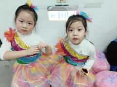 Twins performing in a concert…