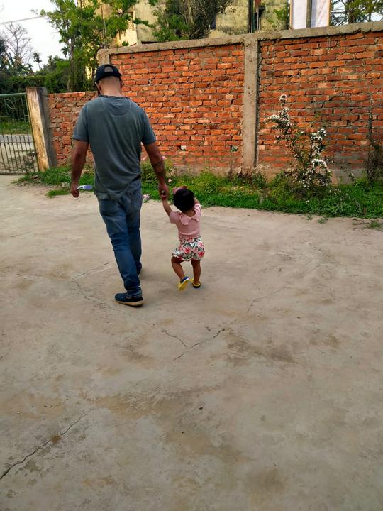 My 1 year old niece walks holding my finger for the first time